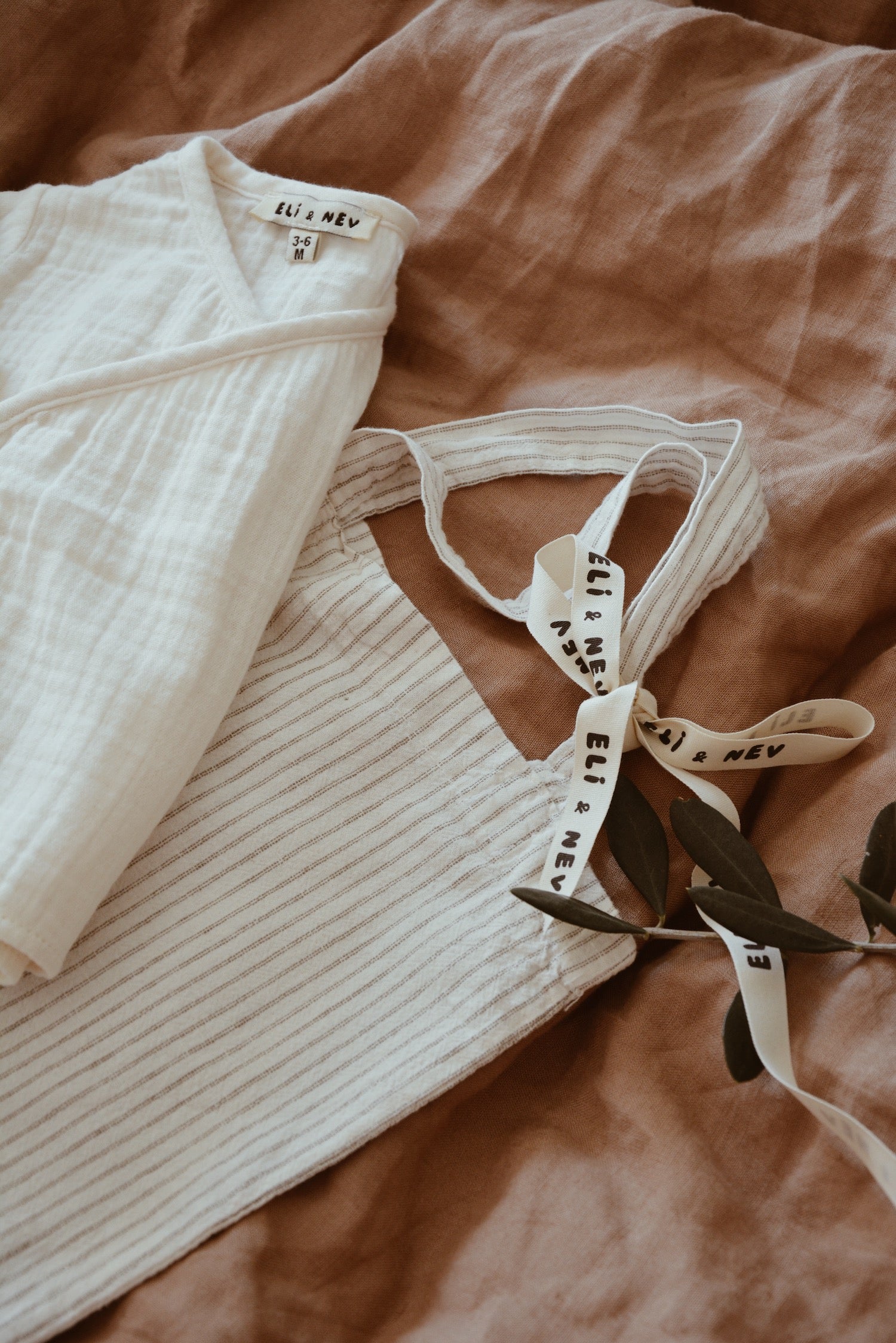 baby cardigan clothing in cream with a tote bag