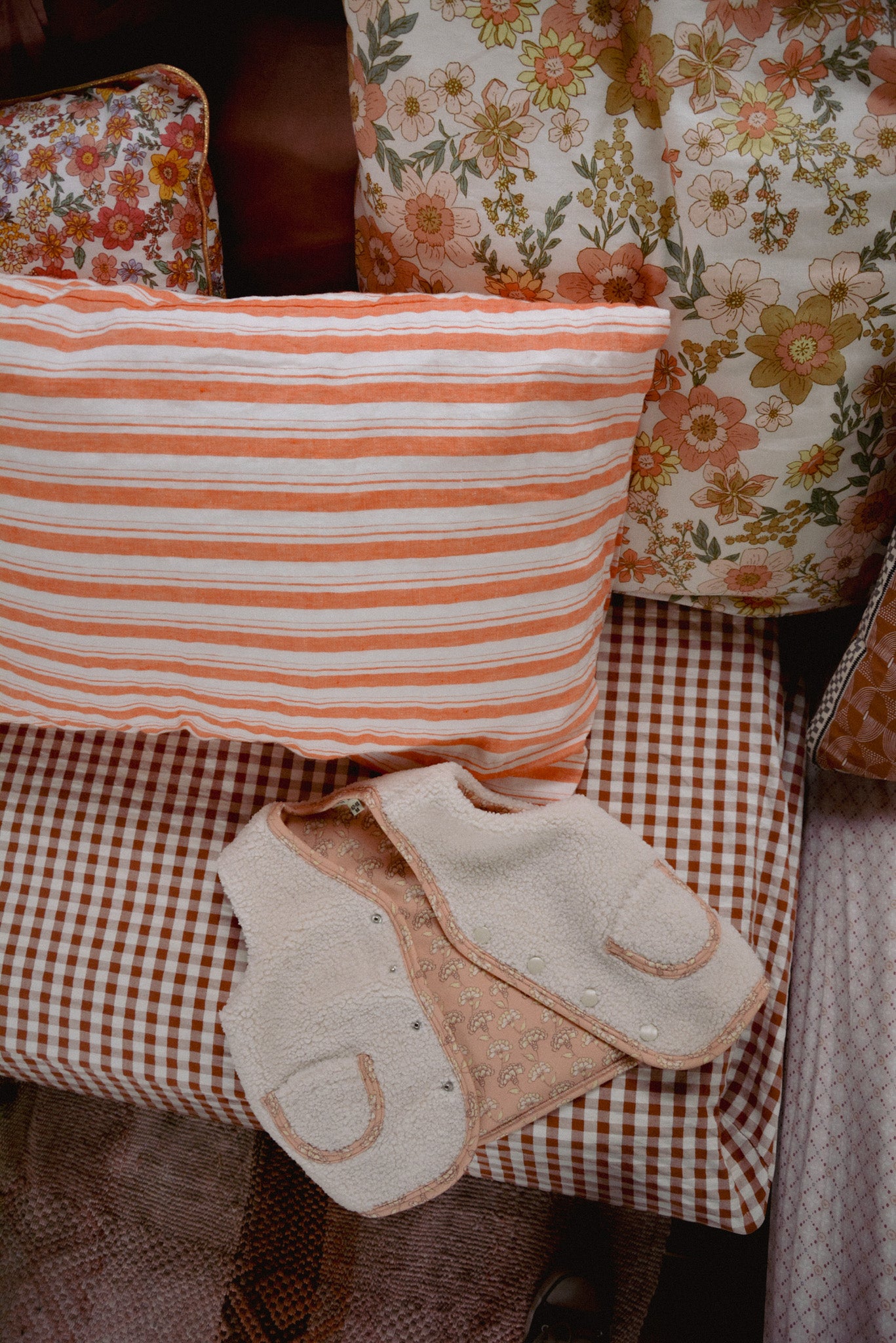 Rosalie Teddy jacket – Cozy Cream Sleeveless Baby Vest with Pink Floral Lining, Perfect Boho Fall & Winter Layering
