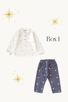 White shirt with star pattern and blue pants with bird pattern on a white background
